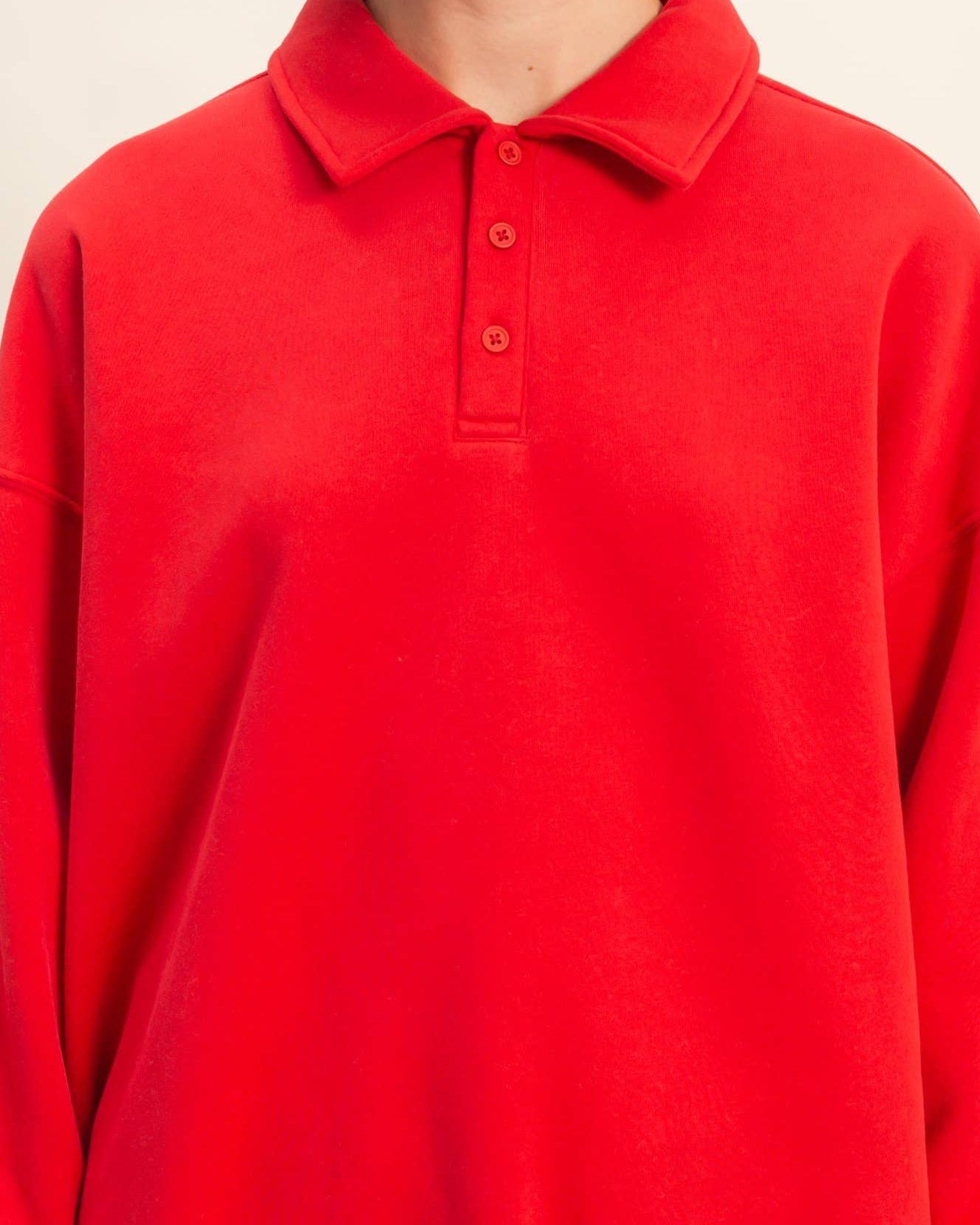 Red long-sleeve polo shirt on a white background
